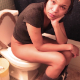 A black girl takes a piss and a shit while sitting on a toilet. Poop is soft and gassy sounding. She wipes repeatedly while standing, allowing us to see the dirty TP. Product is seen flushing down. See Movie# 8065 for more. 720P HD. About 2.5 minutes.